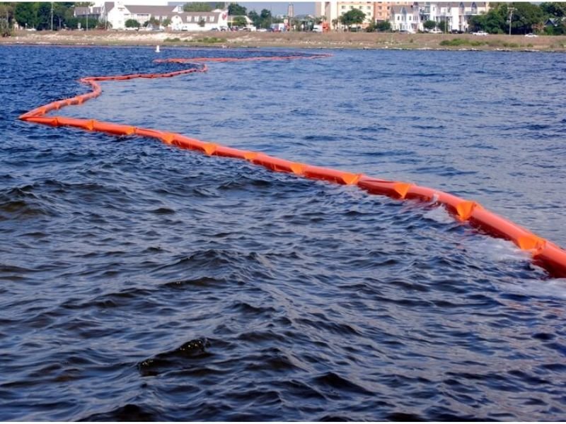 Environmental protection using silt curtains in harbor dredging project